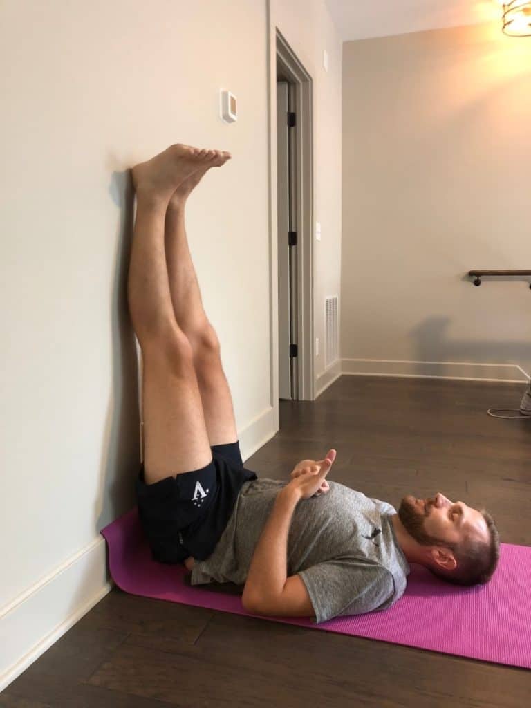 Dan stretching on wall - How to Relieve Foot and Leg Pain from Standing All Day in 6 Simple Steps-min