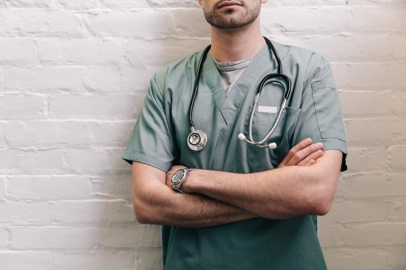 male-doctor-standing-with-arms-crossed _ How to Best Prepare for Night Shift and Stay Healthy _ theothershift.com