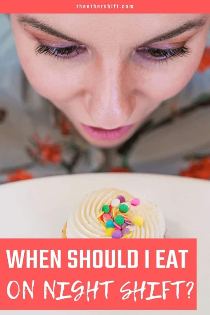 Girl looking at cupcake with icing