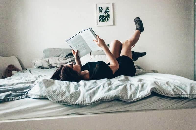 women in bed reading | How Can I Sleep Without My Boyfriend?