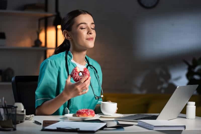 women eating donut