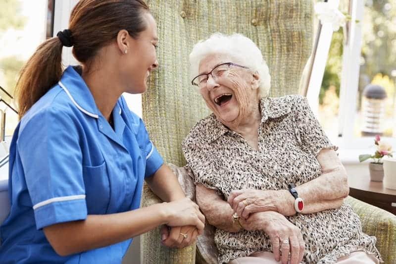 Older women smiling with nurse